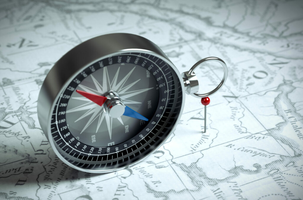Compass On The Map And Red Pin. 3D Scene.