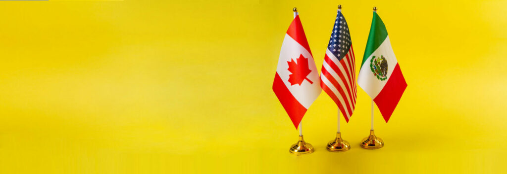 The flags of Canada, Mexico, and the United States infront of a yellow background.