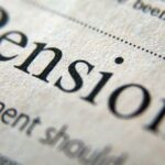 Closeup of the word pension in a newspaper.